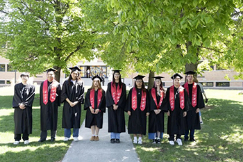 St. Joseph’s Indian School seniors gather in their caps and gowns before the Chamberlain High School commencement ceremony, celebrating years of hard work, growth and community.