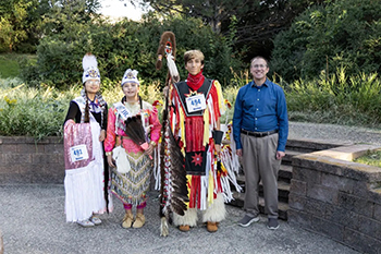 St. Joseph’s 2026 Powwow Royalty gather with Fr. Greg Schill, SCJ, following the Powwow Royalty Competition. Together, they represent leadership, cultural pride and the spirit of service at St. Joseph’s Indian School.