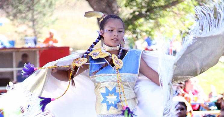 A young female student dances at St. Joseph’s annual powwow, an opportunity for others to learn about the Native American culture.