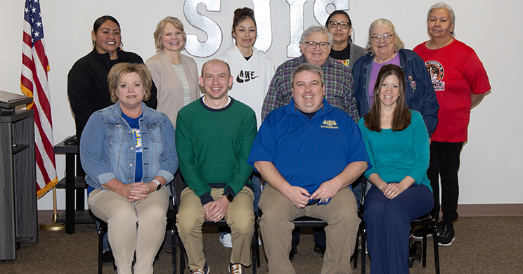 The Parental Advisory Committee poses for a photo after discussions about Native American family integration.