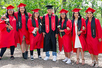 St. Joseph's 2018 graduates pose in their cap and gowns. These students are part of St. Joseph's High School program.