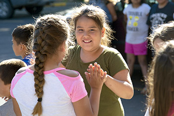 Children play and have fun with friends in the safe and secure environment of St. Joseph's Indian School's campus.